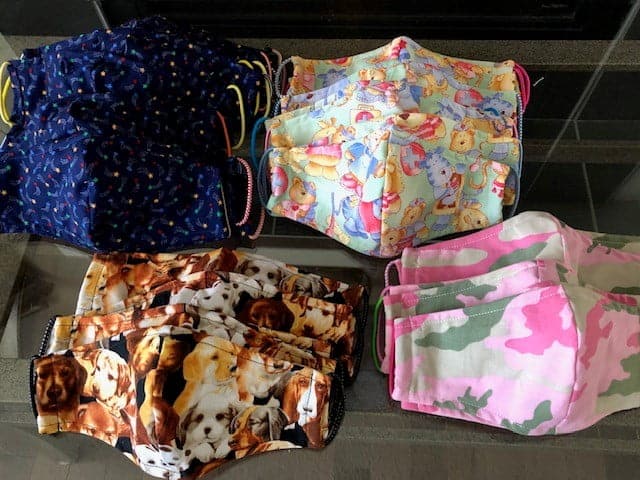 Colourful fabric masks featuring animal prints and patterns.