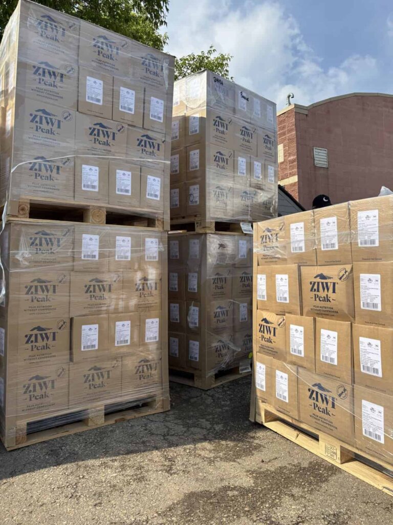 Pallets of pet food stacked.
