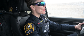 Image of an Alberta SPCA Peace officer driving a vehicle, on the way to an investigation.